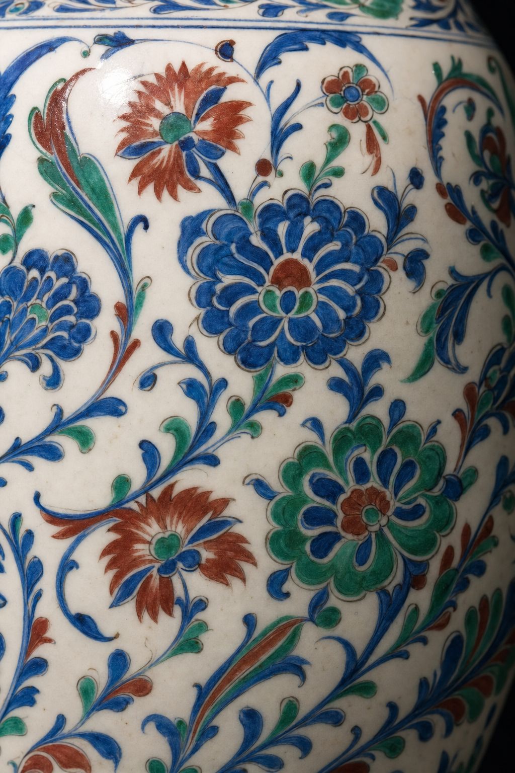 Close detail of glazed ceramic painted with saz leaves and rosettes