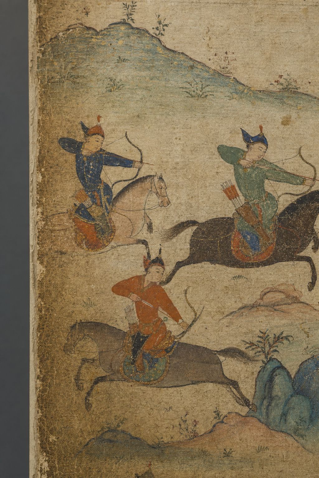 Detail of a manuscript page showing mounted riders on steppe horses