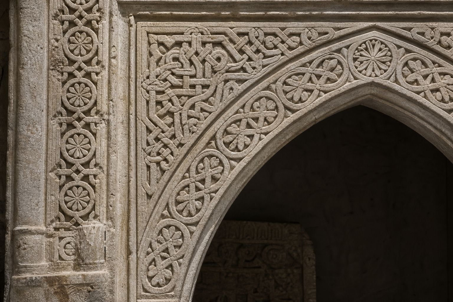 Carved stone doorway with deeply cut interlacing geometric bands